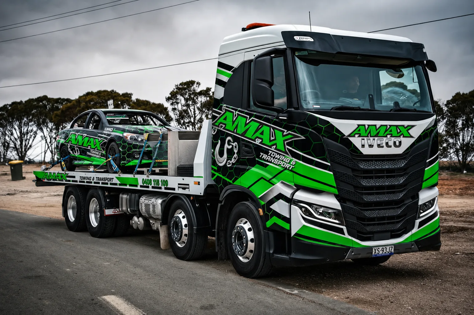 AMAX tilt tray truck carrying a race car in Whyalla, South Australia